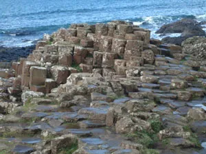 Columnar coastal rocks beside the sea