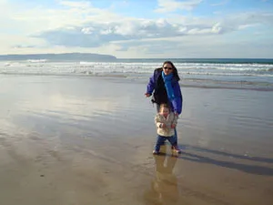 Adult and child on a beach